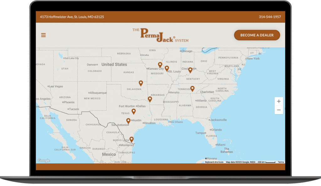 Laptop screen showing the updated Perma Jack website with an interactive map of dealer locations across the United States.