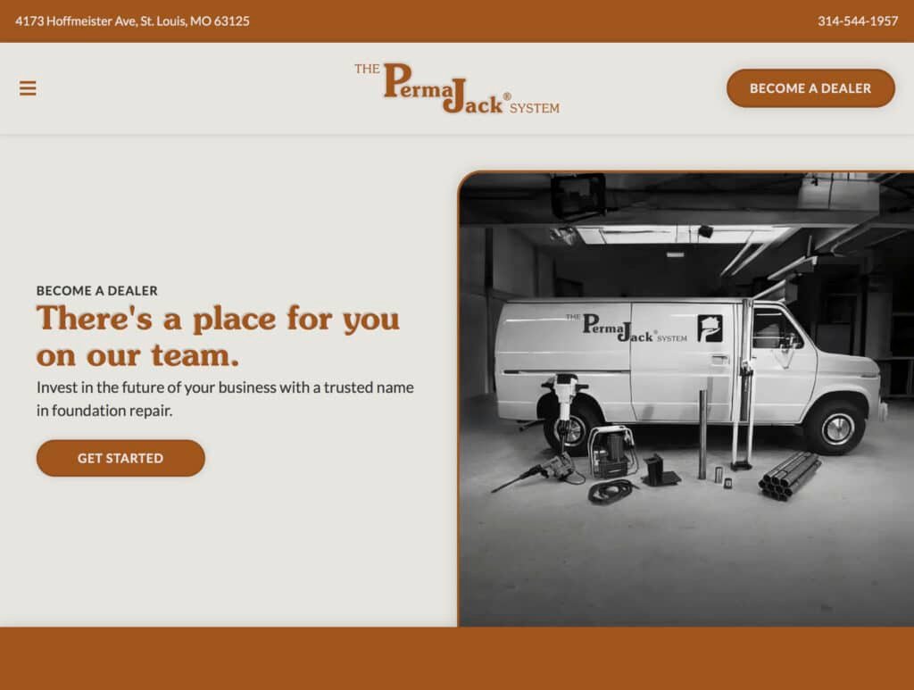 Screenshot of the current Perma Jack website's "Become a Dealer" landing page, with a brown header bar showing the company address, phone number, hamburger menu icon, centered logo, and "Become a Dealer" button. Below, a "Become a Dealer" label introduces the headline "There's a place for you on our team," with supporting text about investing in a trusted foundation repair brand and an orange "Get Started" button. To the right is a black-and-white photo of a Perma Jack branded van parked in a garage, surrounded by foundation repair equipment including pier rods, a hydraulic jack, and hand tools, matching the dealer photo used elsewhere on the site.