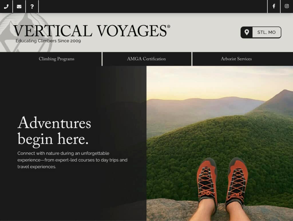 Climber's feet in approach shoes overlooking forested mountain ridge at sunset, Vertical Voyages outdoor adventure homepage